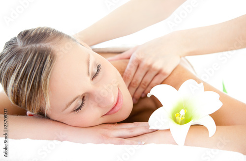 Photo: Relaxed woman receiving a back massage Relaxed woman receiving a back massage