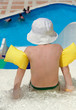 The little boy is going to slide