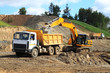Backhoe loader loading dumper
