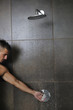 good looking man under man shower
