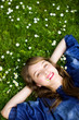 Young woman lying on the grass