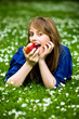 Woman eating red apple