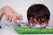 Boy trims lawn. Boy trims lawn.