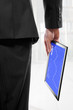Businessman holding a touchpad pc, showing the stock market