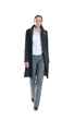 Young business woman in formal clothes walking