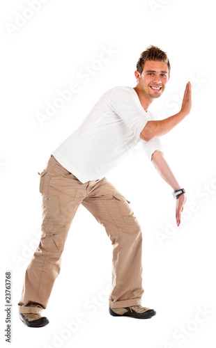 Photo: Man pushing something Man pushing something