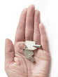 Photo: keys in the hand isolated, on white keys in the hand isolated, on white