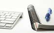 Keyboard and notepad concept, with a ballpoint pen Keyboard and notepad concept, with a ballpoint pen