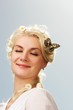 Lovely woman with a butterfly over blue sky