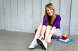 Teenage girl sitting with books