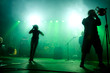 Band on stage at concert.