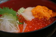 Salmon fish roe (ikura) sea urchin (uni) and scallop (hotate)