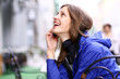 Happy young lady talking on mobile phone Happy young lady talking on mobile phone