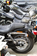 Motorbike's chromed engine. Bikes in a street