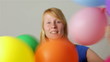 Woman cheering with balloons Woman cheering with balloons