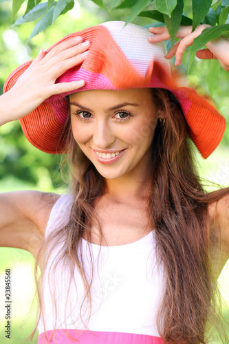 Photo: Pretty cheerful woman in the garden Pretty cheerful woman in the garden