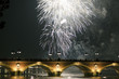 silver fireworks over bridge