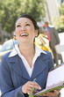 Young businesswoman with diary  laughing