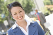 Portrait of young businesswoman at street