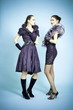 Beautiful fashion girls on the blue background Beautiful fashion girls on the blue background