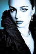 Beautiful fashion girl on the blue background Beautiful fashion girl on the blue background