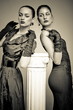 Beautiful fashion girls on the grey background Beautiful fashion girls on the grey background