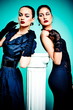 Beautiful fashion girls on the turquoise background Beautiful fashion girls on the turquoise background