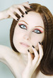 Woman with black nail polish and dark make-up Woman with black nail polish and dark make-up