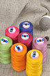 Colorful threads and pincushion close up Colorful threads and pincushion close up