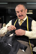 Traditional tailor working at studio Traditional tailor working at studio