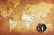 An old brass compass on a Treasure map background