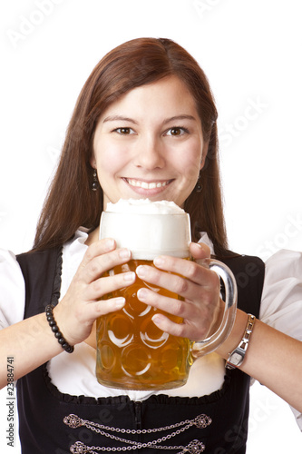 Photo: bayerische Frau im Dirndl mit Oktoberfest Maßkrug - beer stein bayerische Frau im Dirndl mit Oktoberfest Maßkrug - beer stein