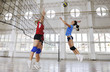 girls playing volleyball indoor game