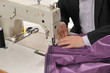 Tailor using industrial sewing machine. Tailor using industrial sewing machine.