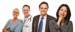 Hispanic Woman with Husband and Male Doctors or Nurses
