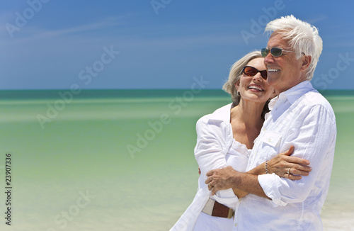 Photo: Happy Senior Couple Looking To Sea on A Tropical Beach Happy Senior Couple Looking To Sea on A Tropical Beach