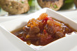 Chutney with meatballs in background