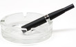 Black Electronic cigarette (e-cigarette) in ashtray