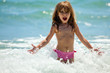 Little girl at sea in sunny day