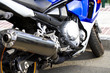 Motorbike's chromed engine. Bikes in a street