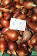 Big shallots with price tag on sale at the market, Valletta