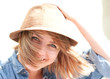 Smiling woman with hair blowing in sunshine