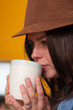 Fashionable Girl Drinking from Coffee Mug