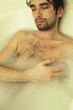 young sexual tanned naked guy in bath