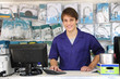portrait of a sales assistant behind the counter