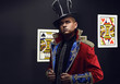 Serious Man in expensive suit of illusionist-conjurer.