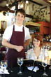 waiter and happy costumer at the restaurant