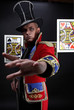 Man with hand extended forward in expensive suit of illusionist-