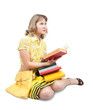 Female student reading book over white Female student reading book over white