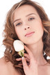 Close-up of beautiful girl with white rose flower